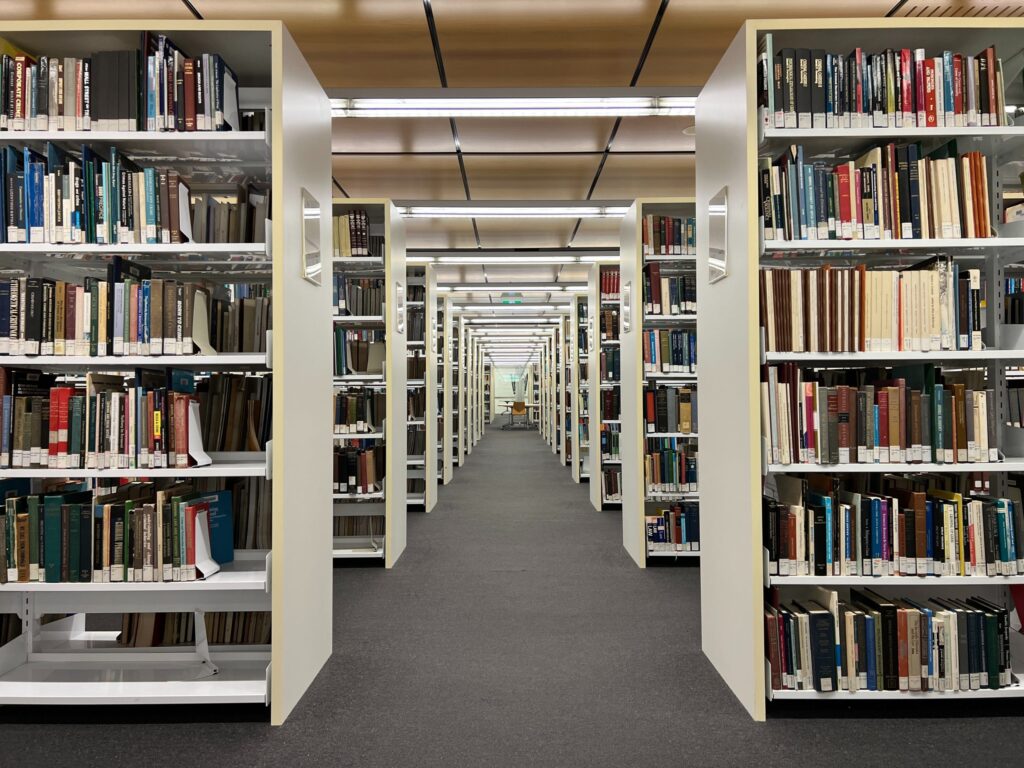 Library with shelves of stacked books